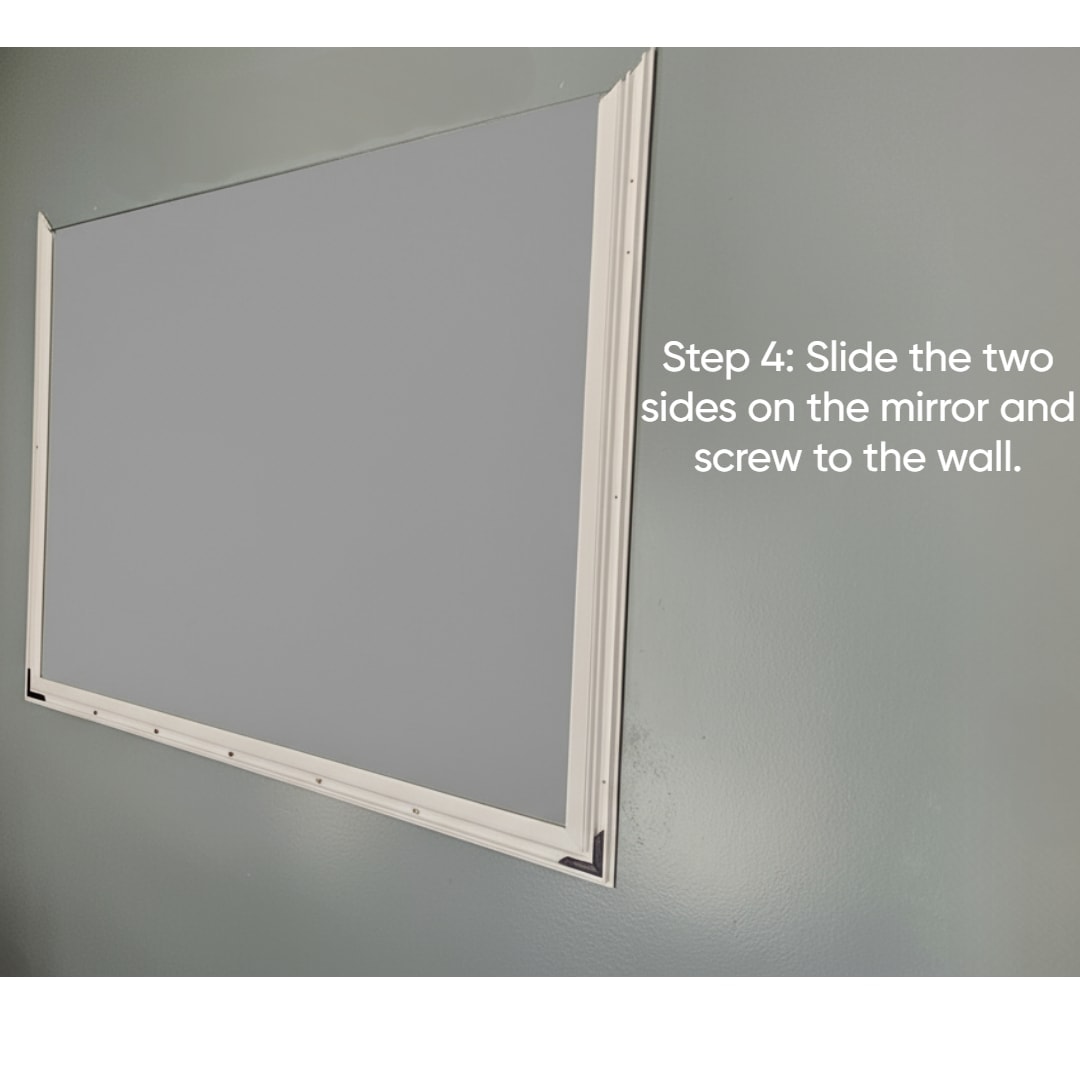 Finished framed mirror in a modern bathroom