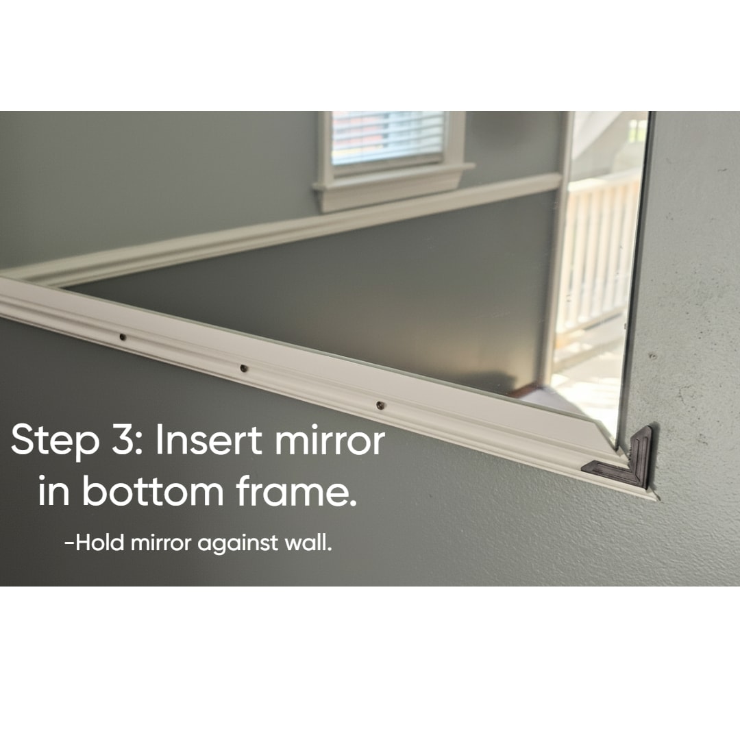 Pressing the mirror channel frame onto the edge of a mirror